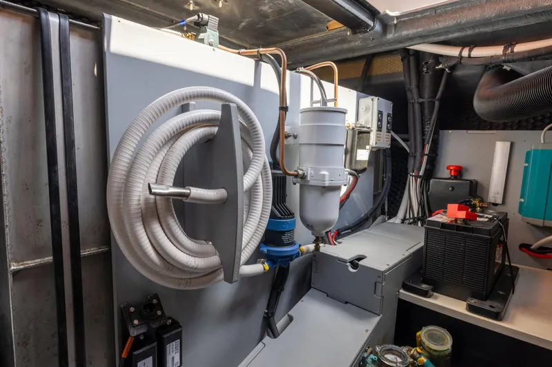 Slide: The Image of Engine room of 2022 Cranchi A46 Luxury Tender with coiled hose and equipment. - 76