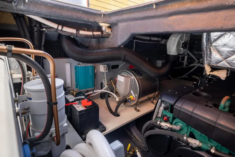 Slide: The Image of Engine room of 2022 Cranchi A46 Luxury Tender, showcasing mechanical components and wiring. - 77