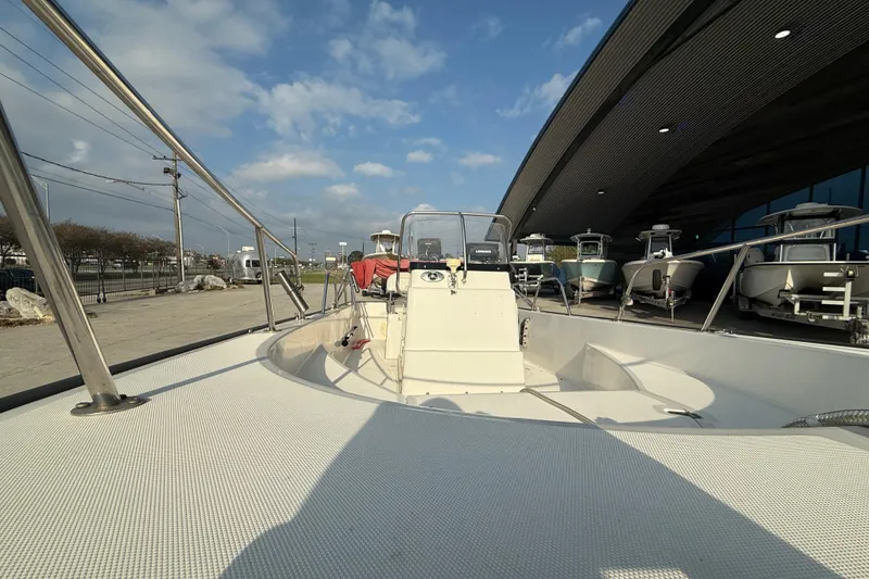 Slide: The Image of 2005 Boston Whaler 17 Montauk boat displayed outdoors under a clear sky. - 12