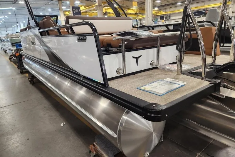 The Image of 2026 Avalon 23 LSZ VRB Windshield pontoon boat in showroom, side view. - 1