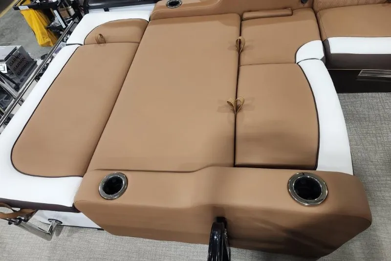 Slide: The Image of 2026 Avalon 23 LSZ VRB Windshield boat interior with tan and white seating. - 10