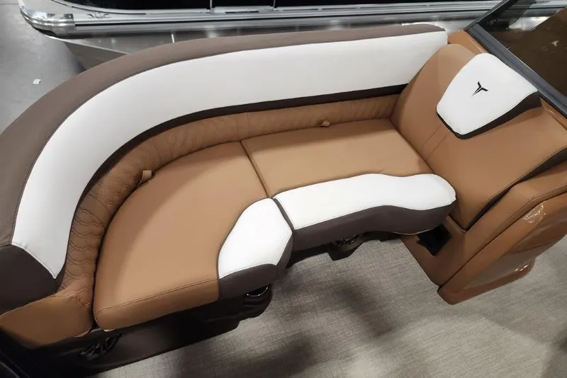 Slide: The Image of Luxurious seating in the 2026 Avalon 23 LSZ VRB Windshield boat, featuring brown and white upholstery. - 13
