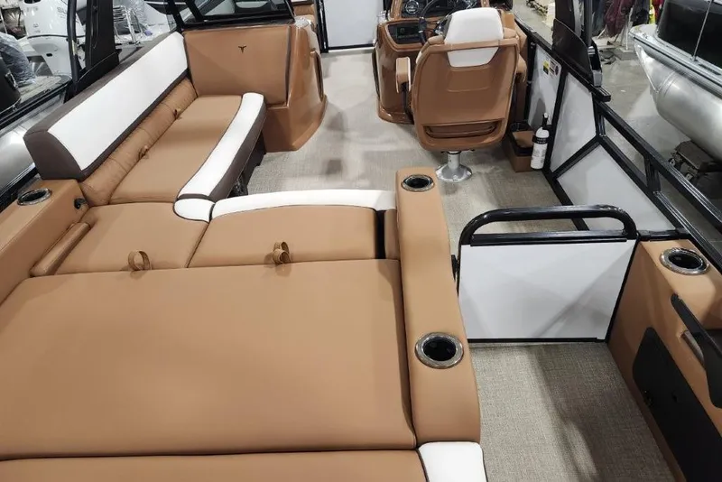 Slide: The Image of Luxurious interior of 2026 Avalon 23 LSZ VRB Windshield boat with tan seating. - 14