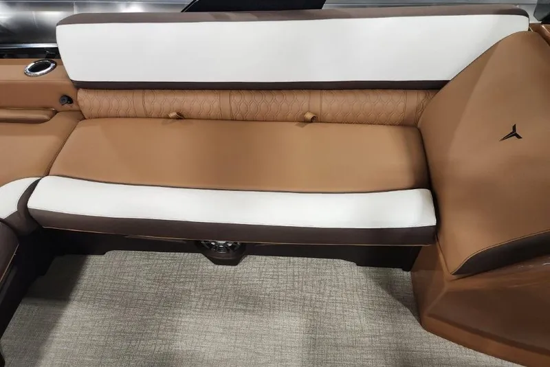 Slide: The Image of Luxurious seating in the 2026 Avalon 23 LSZ VRB Windshield boat, featuring brown and white upholstery. - 15