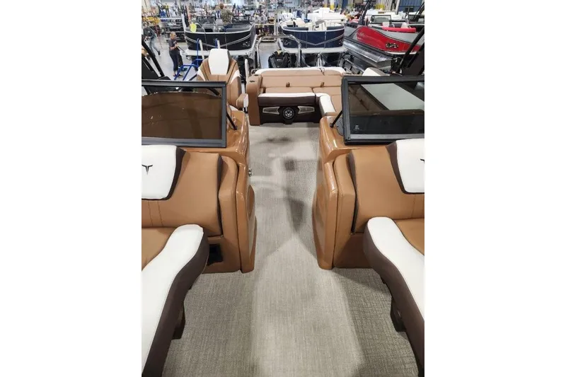 Slide: The Image of 2026 Avalon 23 LSZ VRB Windshield boat interior with tan and white seating. - 16
