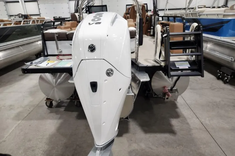 Slide: The Image of 2026 Avalon 23 LSZ VRB Windshield boat with powerful outboard motor in showroom. - 3