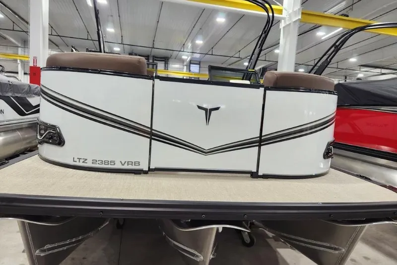 Slide: The Image of 2026 Avalon 23 LSZ VRB Windshield pontoon boat in showroom, rear view. - 4