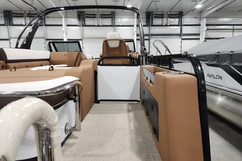 Slide: The Image of 2026 Avalon 23 LSZ VRB Windshield boat interior with tan seating and modern design. - 5