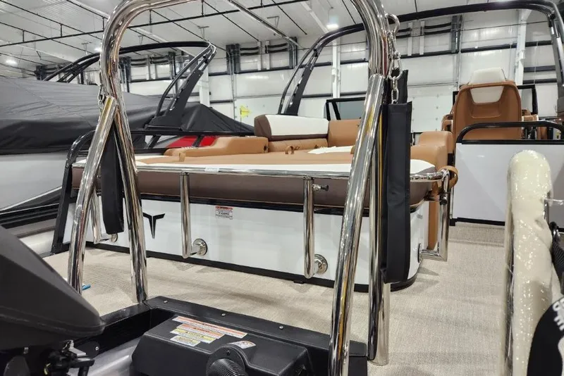 Slide: The Image of 2026 Avalon 23 LSZ VRB Windshield boat interior with chrome details and seating. - 6