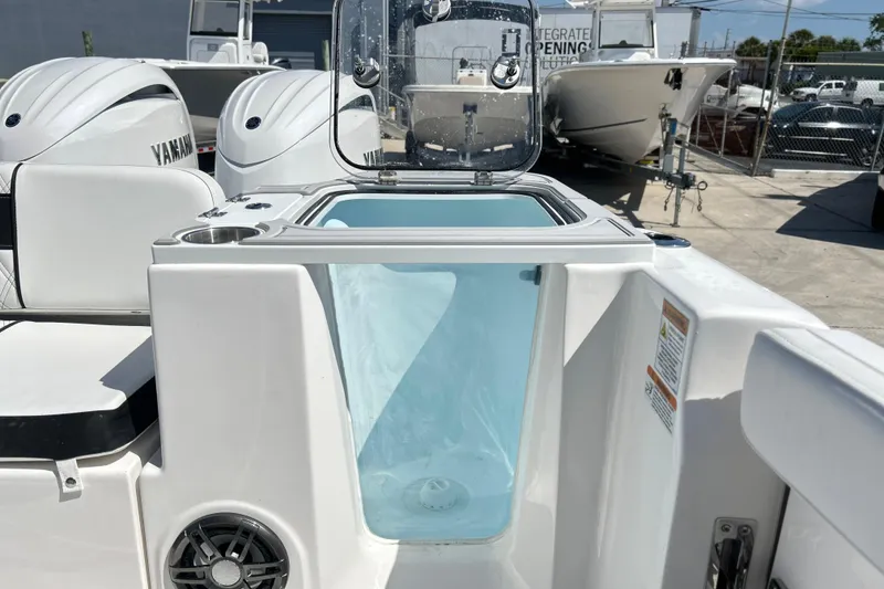 Slide: The Image of 2026 Sea Fox 268 Commander boat with Yamaha engines, featuring a livewell and seating area. - 10