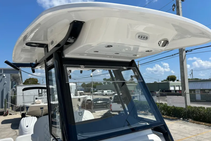 Slide: The Image of 2026 Sea Fox 268 Commander boat console with T-top and clear windshield. - 23