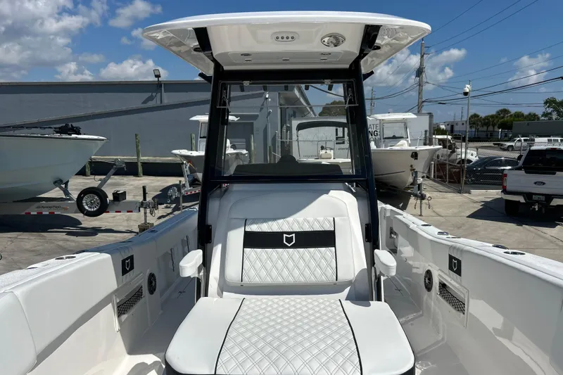 Slide: The Image of 2026 Sea Fox 268 Commander boat interior with white seating and modern design. - 25
