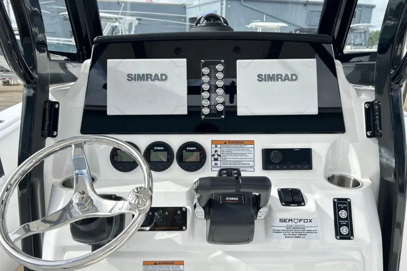 Slide: The Image of 2026 Sea Fox 268 Commander dashboard with Simrad displays and Yamaha controls. - 28