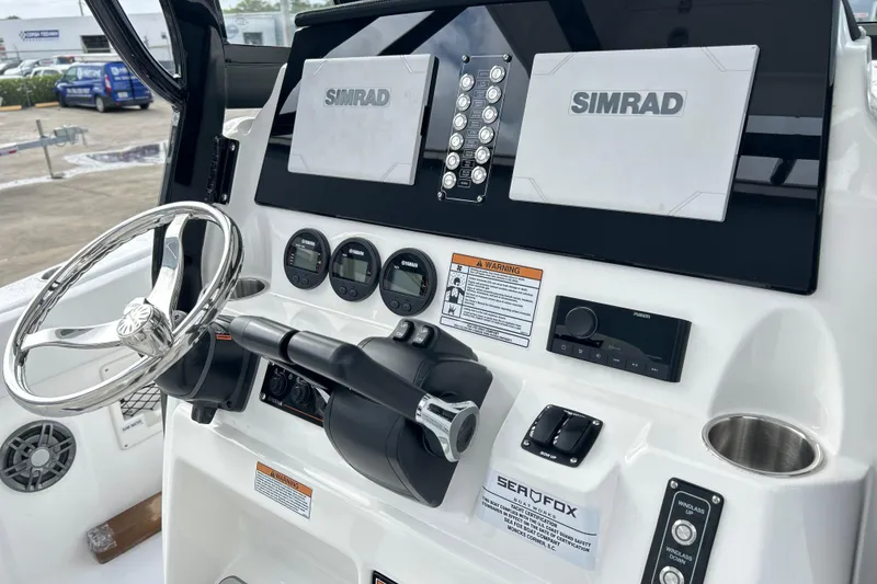 Slide: The Image of Helm of 2026 Sea Fox 268 Commander with Simrad electronics and modern controls. - 29