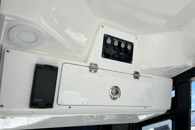 Slide: The Image of 2026 Sea Fox 268 Commander dashboard with control panel and storage compartment. - 35