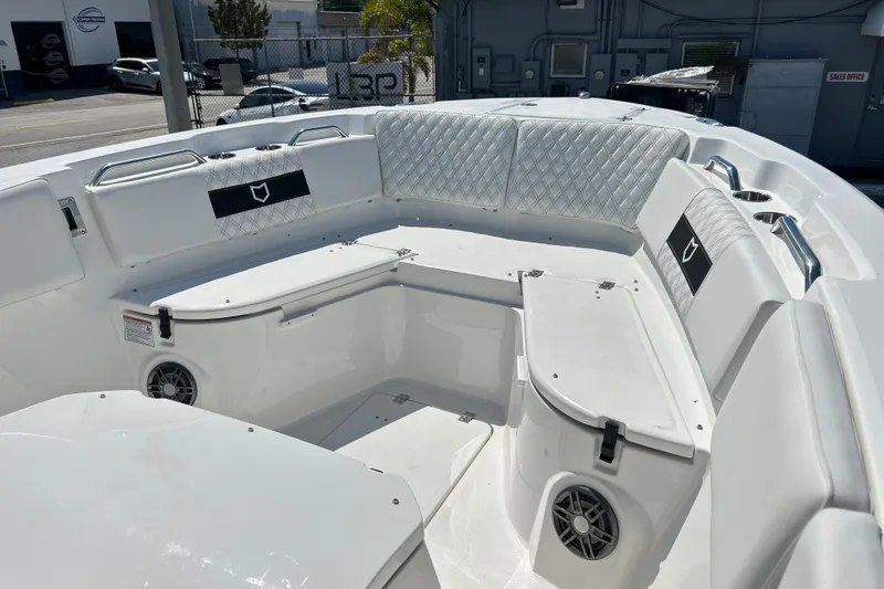 Slide: The Image of 2026 Sea Fox 268 Commander boat interior with white seating and storage compartments. - 37