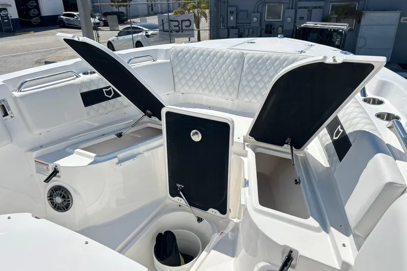 Slide: The Image of 2026 Sea Fox 268 Commander boat interior with open storage compartments and seating. - 39