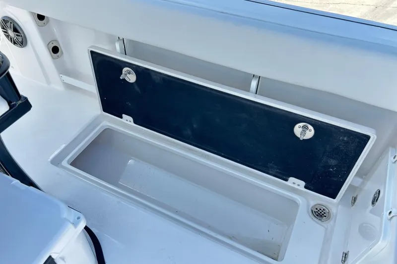 Slide: The Image of 2026 Sea Fox 268 Commander storage compartment with open lid, showcasing interior space. - 42
