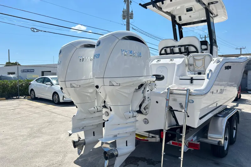 Slide: The Image of 2026 Sea Fox 268 Commander boat with dual Yamaha outboard engines on a trailer. - 45