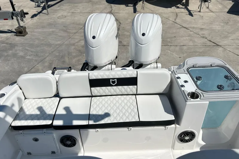 Slide: The Image of 2026 Sea Fox 268 Commander boat with dual engines and cushioned seating. - 5