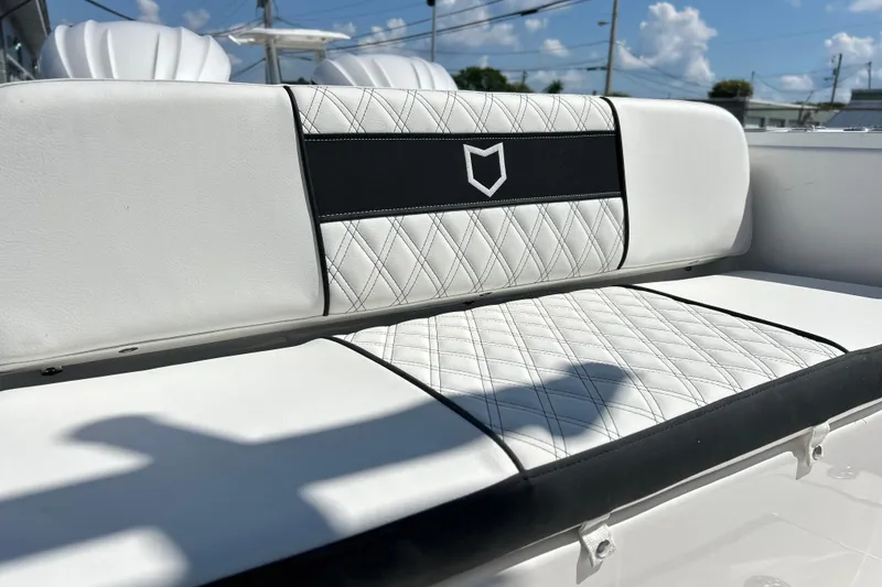 Slide: The Image of White leather seating on 2026 Sea Fox 268 Commander boat, featuring diamond stitching. - 6