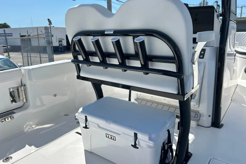 Slide: The Image of 2026 Sea Fox 268 Commander boat interior with rod holders and Yeti cooler. - 8
