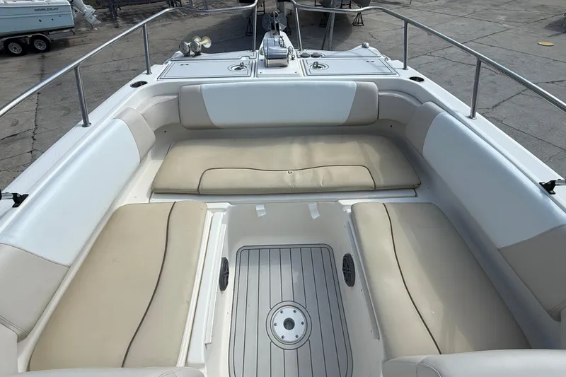 Slide: The Image of 2016 World Cat 255 DC boat interior with cushioned seating and deck view. - 12