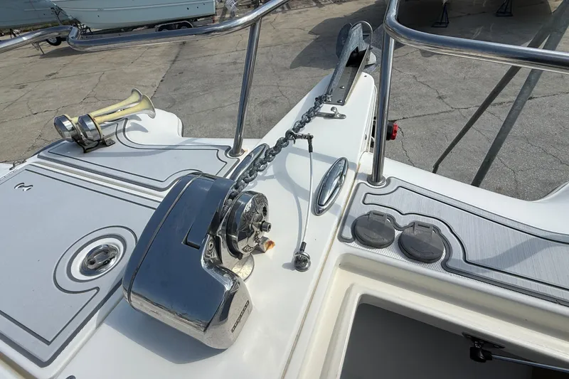 Slide: The Image of 2016 World Cat 255 DC boat deck with anchor chain and horn. - 13