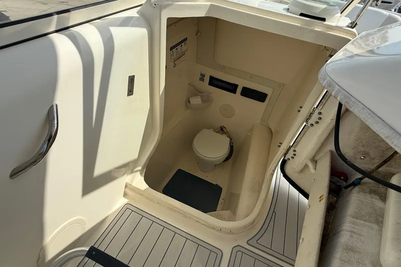 Slide: The Image of 2016 World Cat 255 DC boat interior with compact marine toilet. - 14