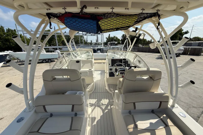 Slide: The Image of 2016 World Cat 255 DC boat interior with seating and steering console. - 18