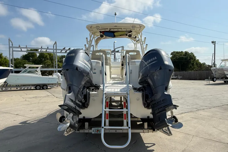 Slide: The Image of 2016 World Cat 255 DC boat with twin Yamaha outboard engines in a marina. - 6