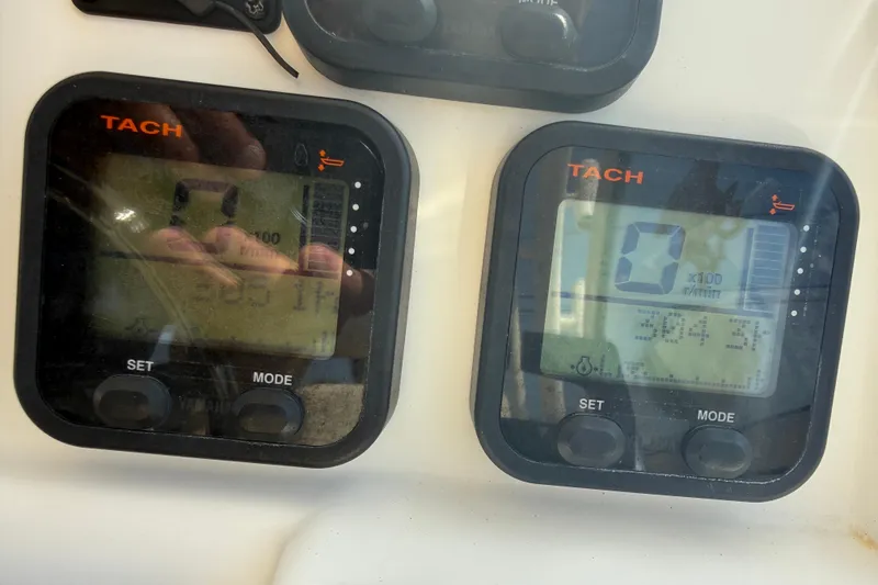 Slide: The Image of Digital tachometers on a 2016 World Cat 255 DC boat dashboard display RPM readings. - 9