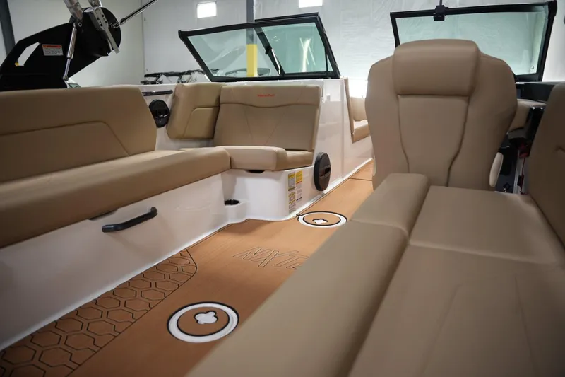 Slide: The Image of Interior of 2025 MasterCraft NXT24 boat with tan seating and modern design. - 13