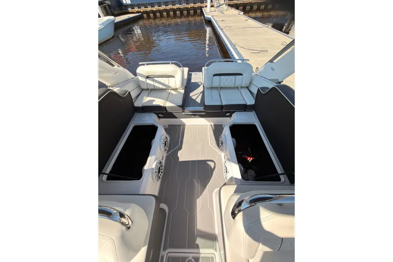 Slide: The Image of 2019 Regal LS4 boat interior with open storage compartments at dockside. - 10