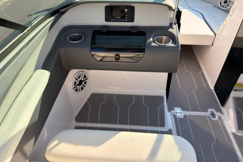 Slide: The Image of 2019 Regal LS4 boat interior with cup holders and speaker system. - 11