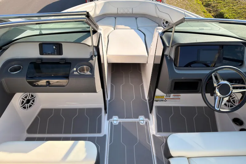Slide: The Image of 2019 Regal LS4 boat interior with modern dashboard and seating. - 12