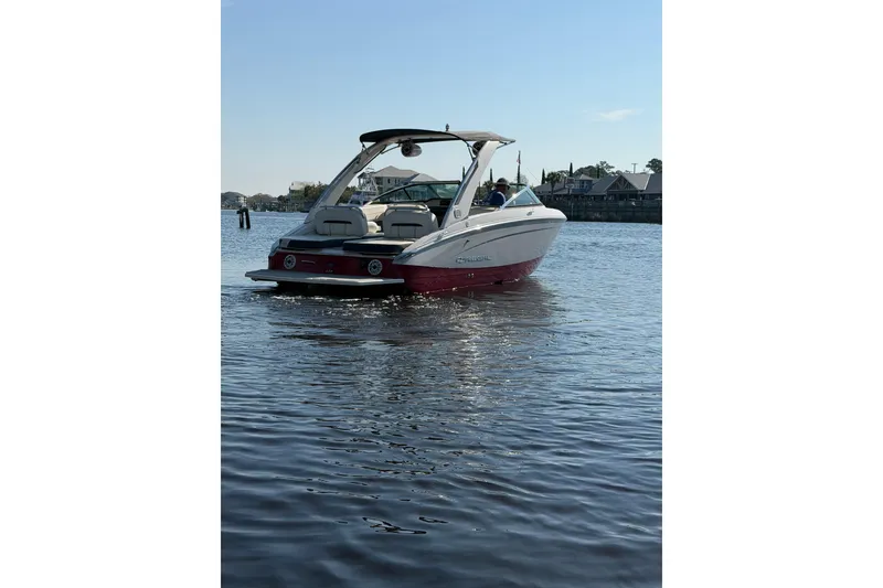 Slide: The Image of 2019 Regal LS4 boat on calm water under clear blue sky. - 2