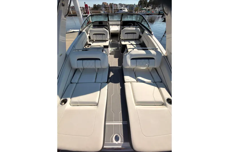 Slide: The Image of 2019 Regal LS4 boat interior with luxurious seating and sleek design. - 6