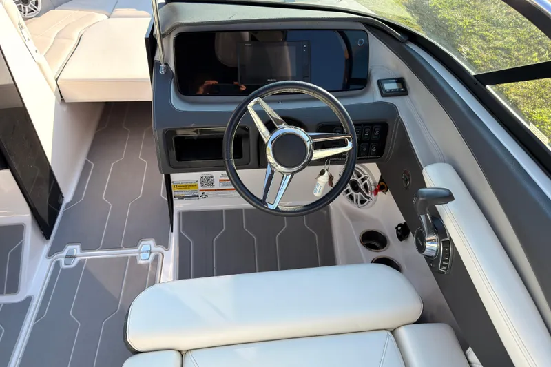 Slide: The Image of 2019 Regal LS4 boat cockpit with steering wheel and modern dashboard controls. - 7