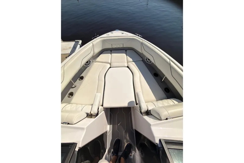 Slide: The Image of 2019 Regal LS4 boat interior with white seating and water view. - 8