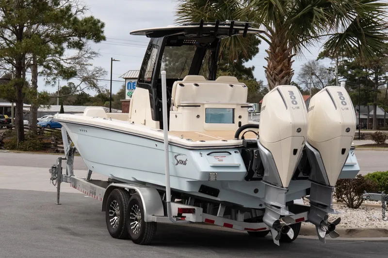 Slide: The Image of 2026 Scout 281 XSS boat on trailer with dual Mercury outboard engines. - 3
