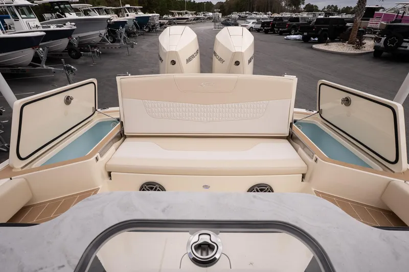 Slide: The Image of 2026 Scout 281 XSS boat interior with seating and storage compartments. - 8