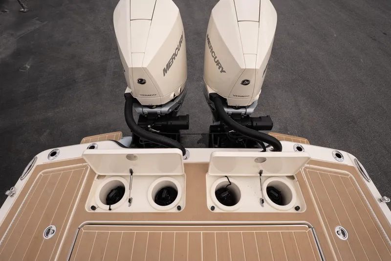Slide: The Image of 2026 Scout 281 XSS boat with dual Mercury outboard engines, featuring a sleek deck design. - 9