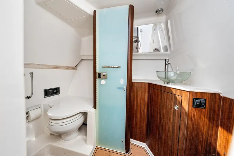 Slide: The Image of 2022 Pursuit DC 365 Dual Console bathroom with modern fixtures and wooden cabinetry. - 34