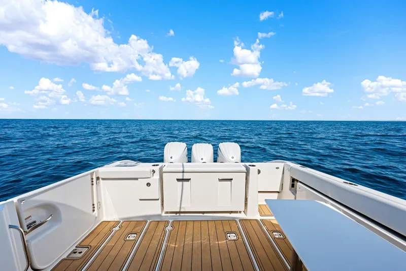 Slide: The Image of 2022 Pursuit DC 365 Dual Console boat deck with ocean view. - 43