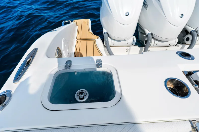 Slide: The Image of 2022 Pursuit DC 365 Dual Console boat with Yamaha engines and teak deck. - 48