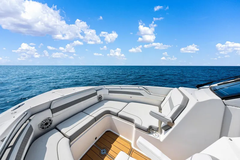 Slide: The Image of 2022 Pursuit DC 365 Dual Console boat interior with ocean view and clear sky. - 53