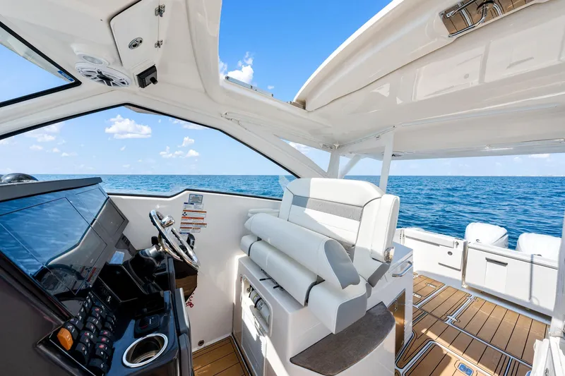Slide: The Image of 2022 Pursuit DC 365 Dual Console boat interior with ocean view. - 58