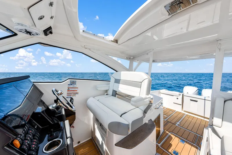 Slide: The Image of 2022 Pursuit DC 365 Dual Console boat interior with ocean view. - 59