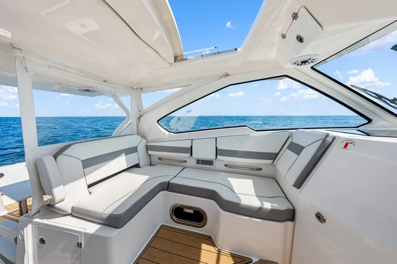 Slide: The Image of Luxurious interior of 2022 Pursuit DC 365 Dual Console boat with ocean view. - 61